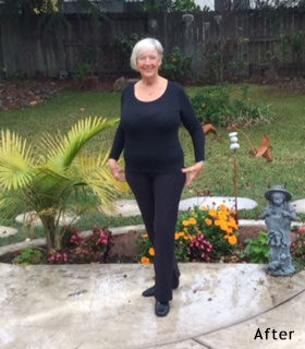 woman smiling in her yard wearing black clothes