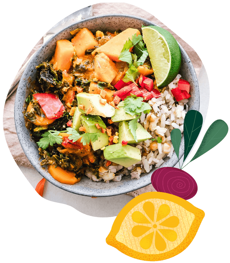 Image of a salad bowl surrounded by leaves